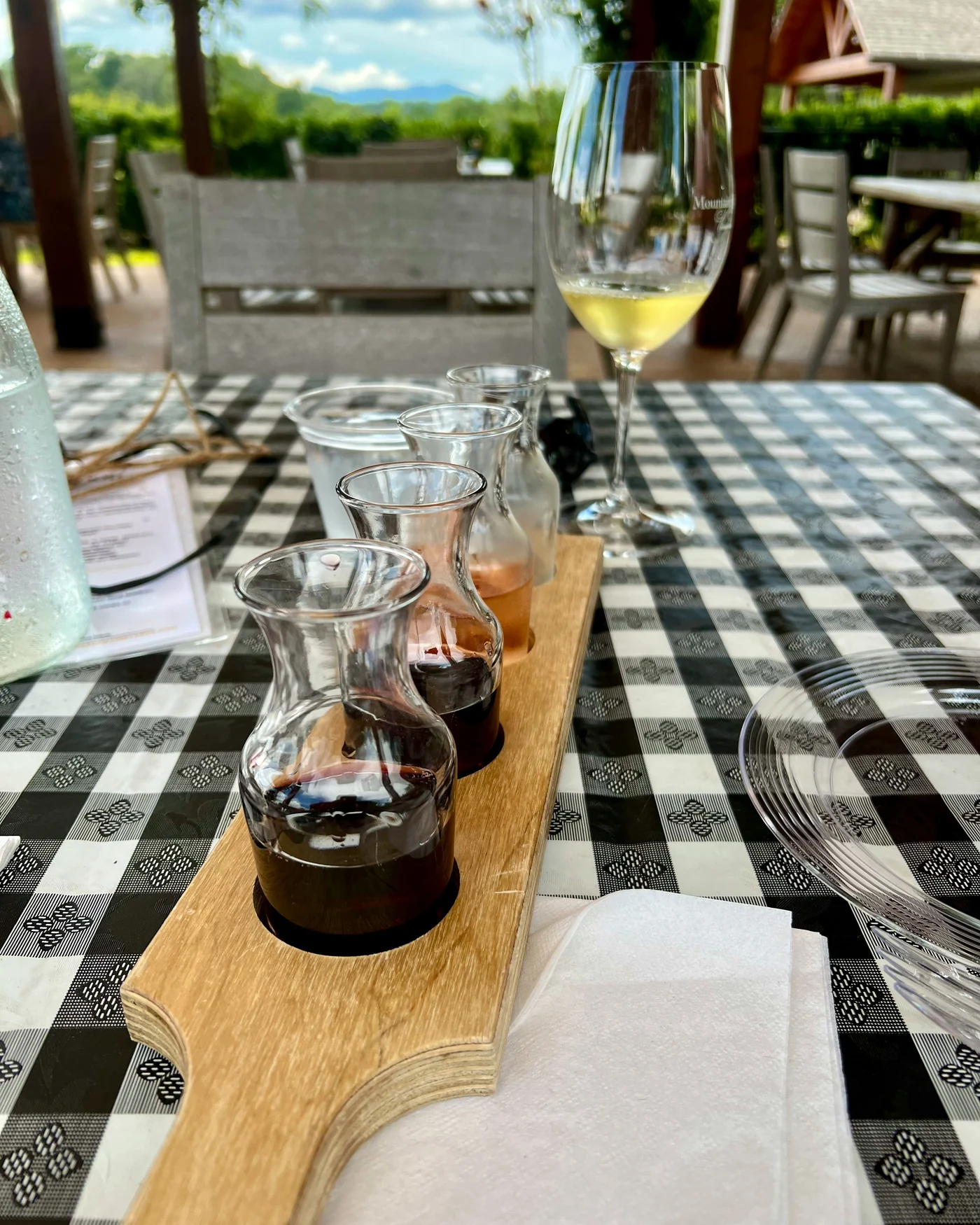 A wine tasting flight served in small carafes
